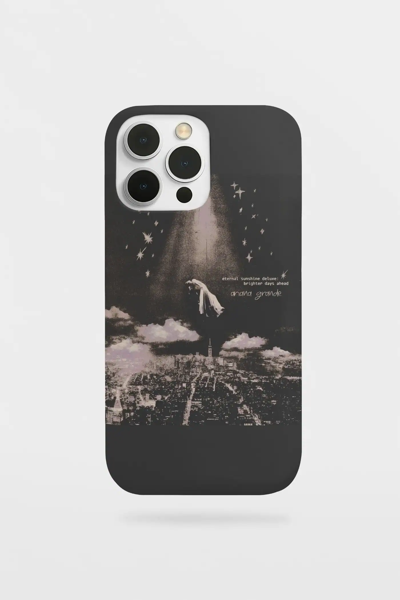 Black and white Ariana Grande merch phone case featuring a cityscape and starry sky design.