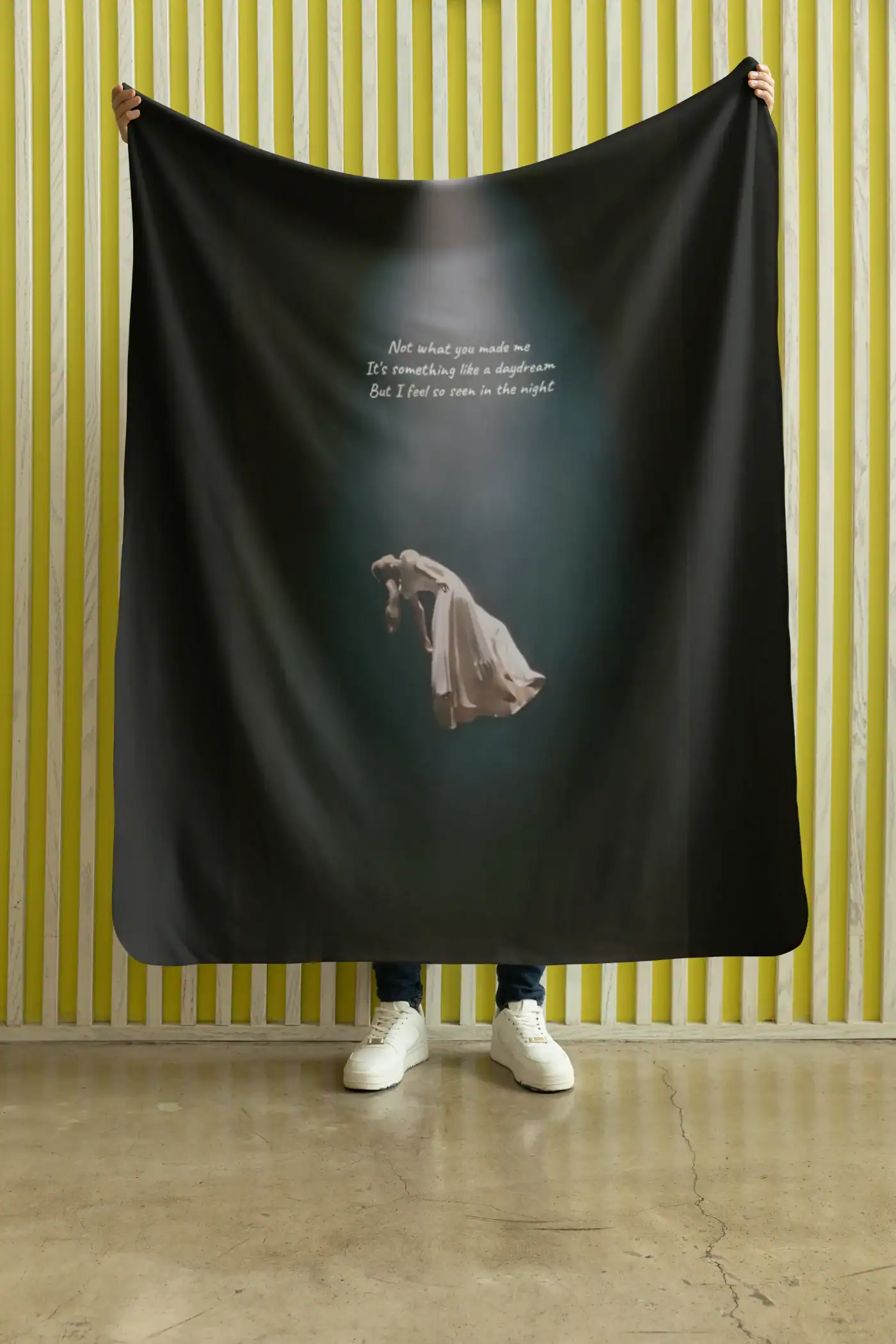 - Ariana Grande merch banner with album artwork and lyrics on a dark background.
