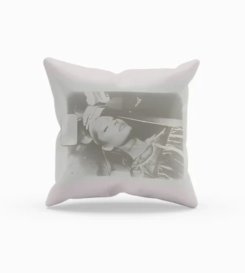 Ariana Grande merchandise pillow with black-and-white photo print of Ariana resting with headphones on.