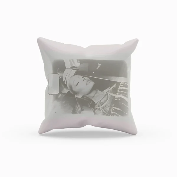 Ariana Grande merchandise pillow with black-and-white photo print of Ariana resting with headphones on.