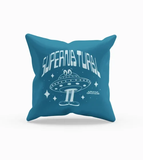 Ariana Grande merchandise pillow with a UFO design and "Supernatural" text, featuring a cartoon alien and stars.