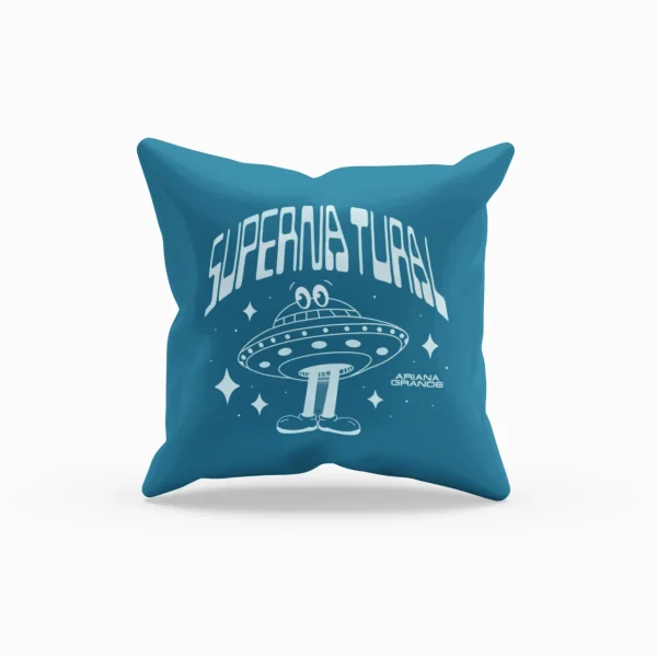 Ariana Grande merchandise pillow with a UFO design and "Supernatural" text, featuring a cartoon alien and stars.