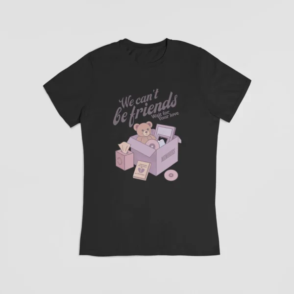 Ariana grande merch, purple teddy bear graphic t-shirt with "We can't be friends" text, cartoon-style illustration, cute and trendy design, perfect for Ariana Grande fans.