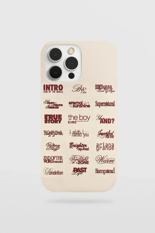 A phone case featuring a collage of song titles and lyrics, including "ariana grande" in cursive text.
