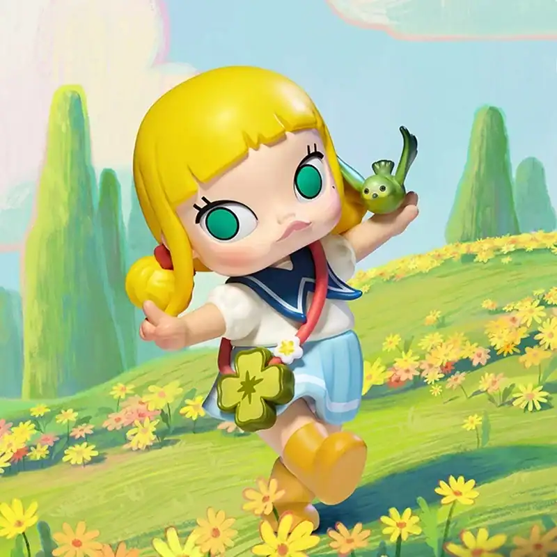 Adorable blythe doll with blonde hair and teal eyes holding a small green toy, standing in a vibrant, colorful meadow with flowers and trees around her.