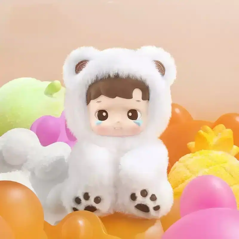 Cute plush doll dressed in a white bear costume surrounded by colorful foam balls and toys.