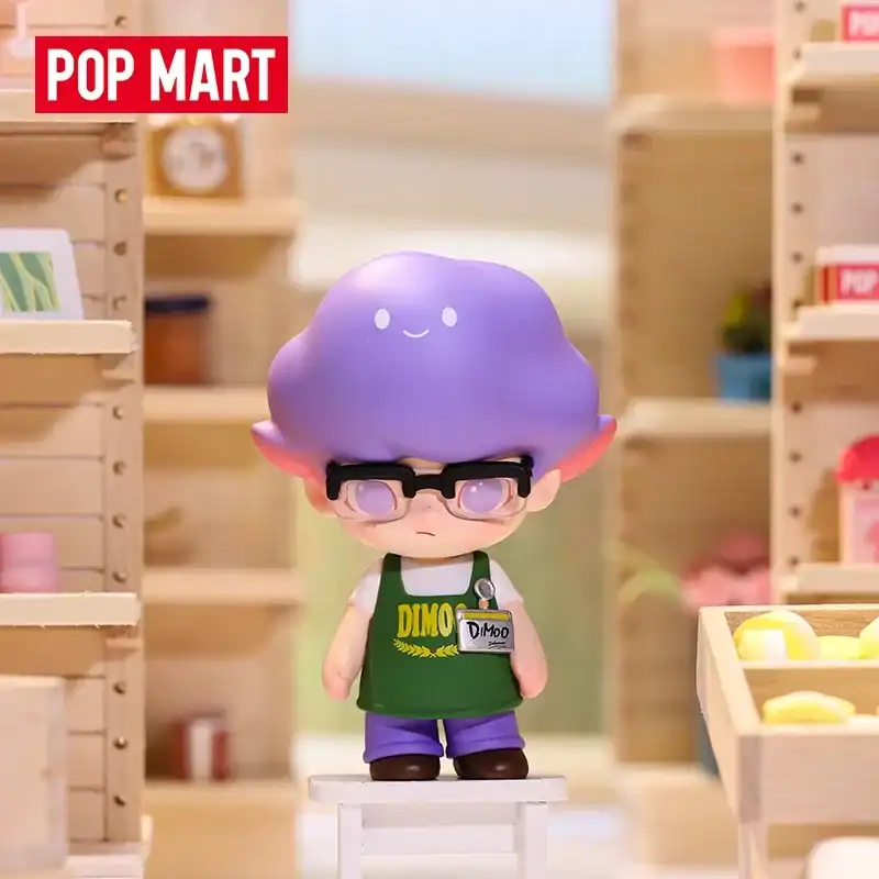 POP MART Ariana Grande merch collectible figurine with pastel purple hair and glasses, displayed in a cute shop setting.